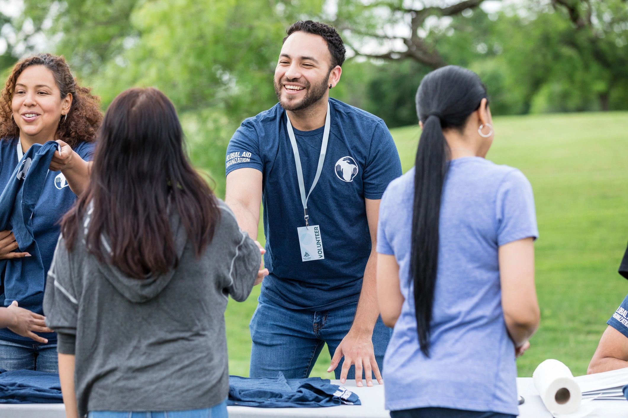 Volunteer welcoming a community member